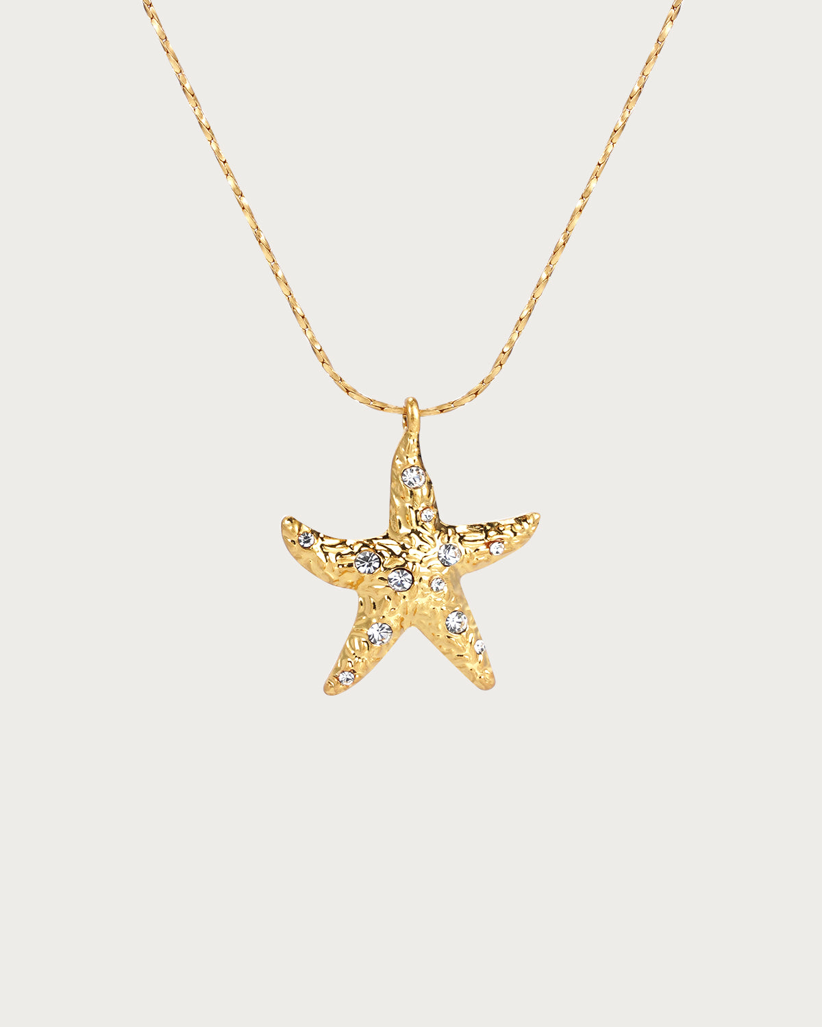 Collar con colgante dorado de perla y estrella de mar