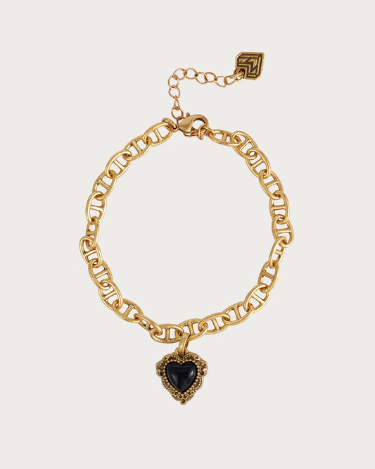 Pulsera dorada con corazón negro
