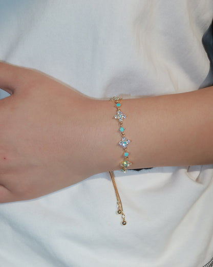 Cloverly Four-Petal Flower Golden Pull Cord Bracelet