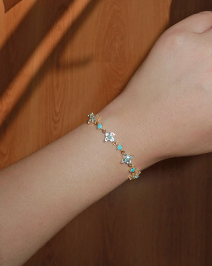 Cloverly Four-Petal Flower Golden Pull Cord Bracelet