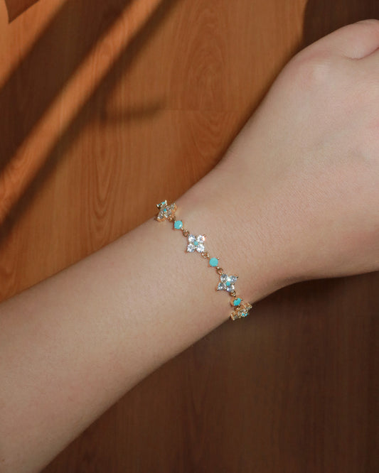 Cloverly Four-Petal Flower Golden Pull Cord Bracelet