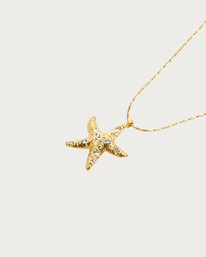 Collar con colgante dorado de perla y estrella de mar