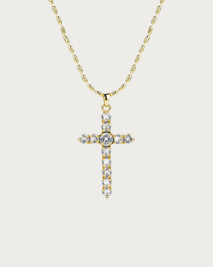 Collar dorado con cruz versátil