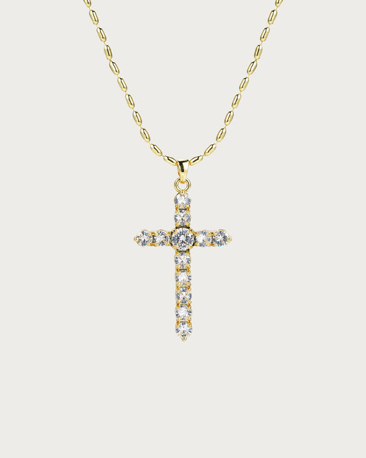 Collar dorado con cruz versátil