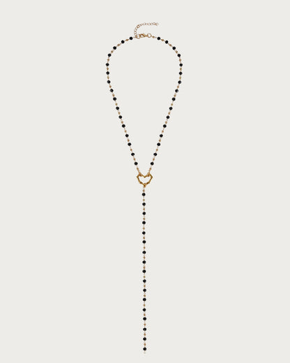 Collar de lazo dorado con corazón de cuentas negras