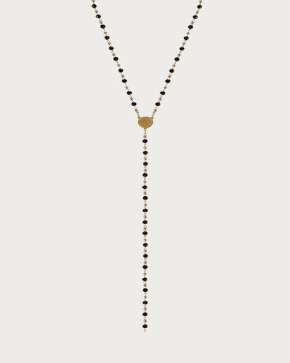 Collar de lazo dorado con monedas y cuentas negras