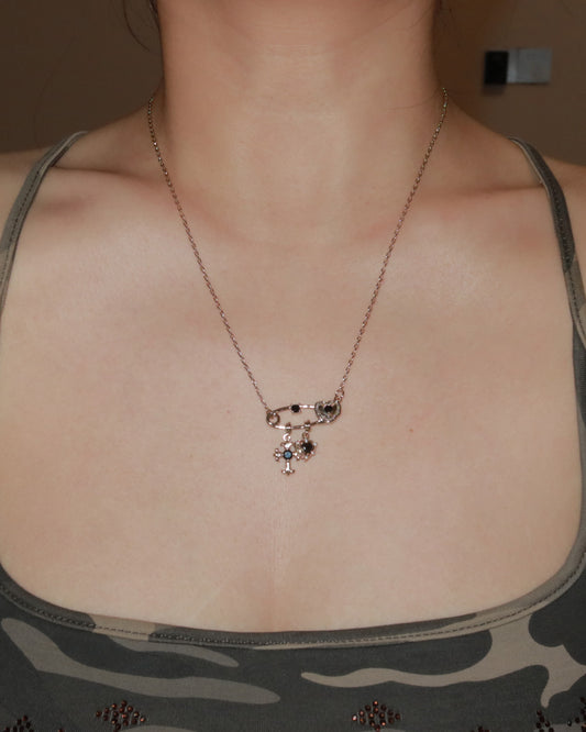 Seraphine Black Crystal Light Golden Safety Pin Cross Heart Necklace